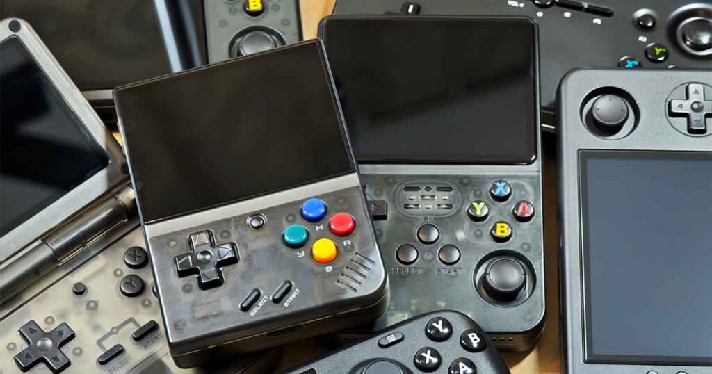 Retro handheld collection closeup shot, Miyoo Mini Plus and the R36S on top.